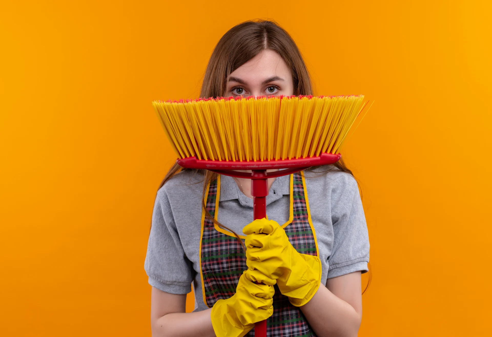 young-beautiful-girl-apron-rubber-gloves-holding-mop-hading-face-it-peeking